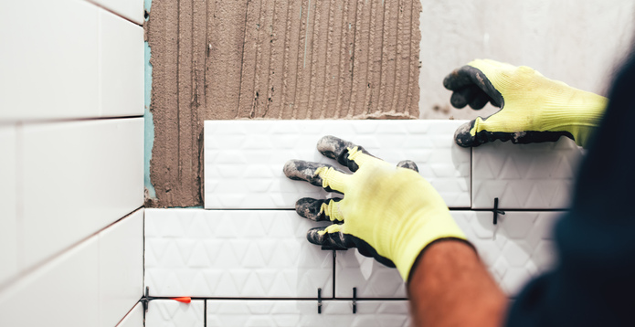 Construction work laying tiles card